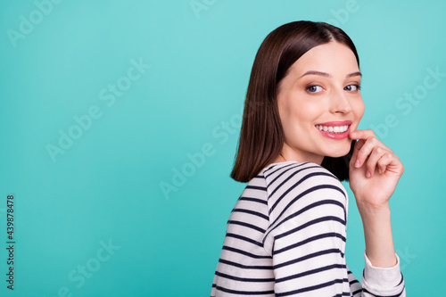 Photo of coquette dream lady beaming white smile finger chin wear striped shirt isolated on turquoise background