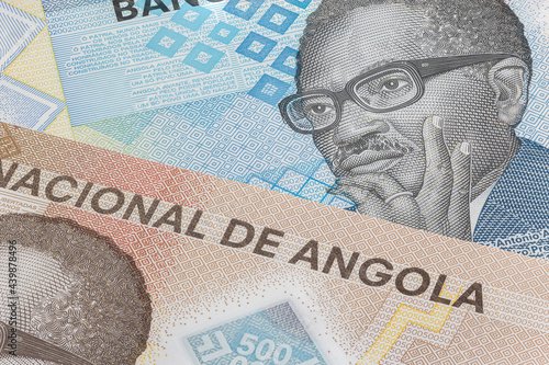 Close up to 200 and 500 Kwanza of the Republic of Angola. Polymer banknotes of the African country. Detailed capture of the portrait of the first president Agostinoh Neto. Currency bank note Kwanzas photo