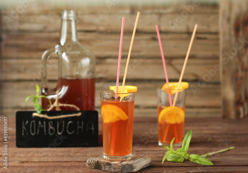 Fermented glass glasses of tea kombucha with fresh оrange