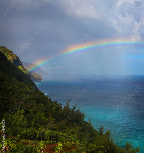 a view of a colorful rainbow with spectacular views of the Kalalau in Kauai, Hawaii, USA. © julie