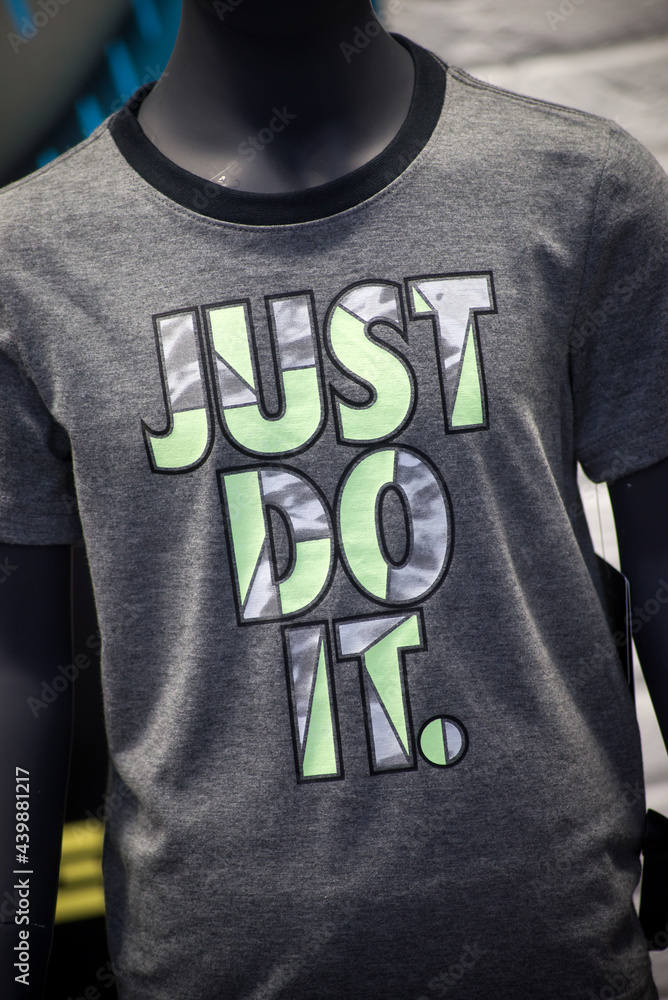 Mulhouse - France - 16 June 2021 - Closeup of just do it logo by nike  compagny on grey teeshirt in a fashion store showroom Stock Photo | Adobe  Stock