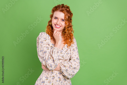 Photo of cute wavy hairdo young lady hand face wear blouse isolated on pastel green color background
