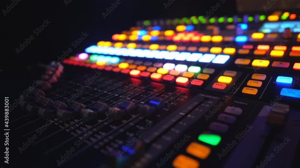 View on dj remote or soundboard with moving and brightly glow buttons. Working process of recording studio. Amplifier and balance of sound. Musical player at night party in club. Slow motion Close up View on dj remote or soundboard with moving and brightly glow buttons. Working process of recording studio. Amplifier and balance of sound. Musical player at night party in club. Slow motion Close up