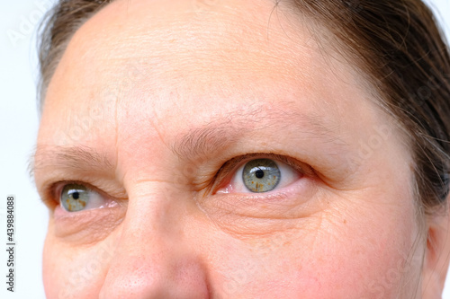Bild auf Leinwand eyes of an elderly woman with wrinkles on the eyelids, part of the face close-up