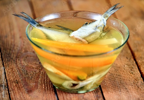 Vegetable soup on a plate on the wooden table photo