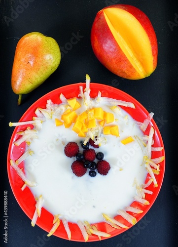 Milk soup on a plate on the wooden table photo