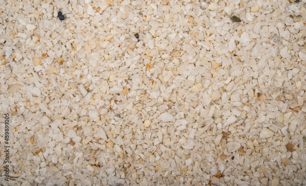 Small white pebble pieces making a pattern background Small white pebble pieces making a pattern background