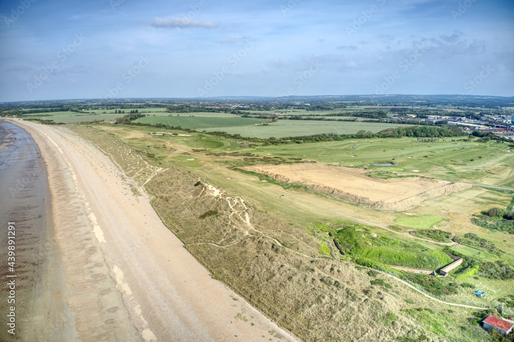 Aerial photo of West Beach at Littlehampton with the sand dunes protecting the links golf course and the beautiful West Sussex countryside.