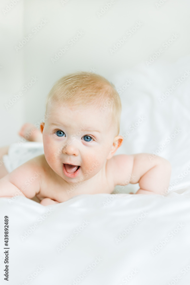 Newborn Boy laying on bed Newborn Boy laying on bed