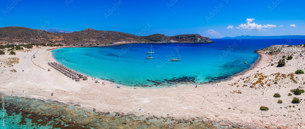 Obraz premium Aerial view of Simos beach in Elafonisos island in Greece. Elafonisos is a small Greek island the Peloponnese with idyllic exotic beaches and crystal clear waters. Laconia, Greece, Europe