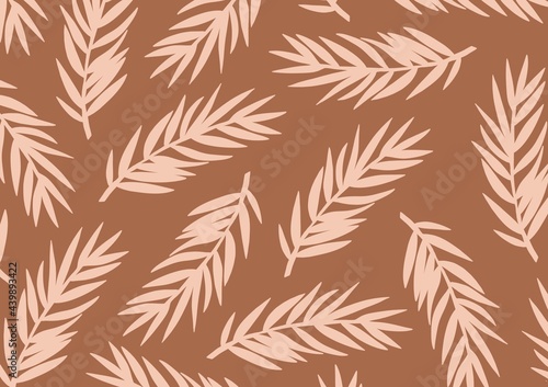 Palm leaves pattern on brown background