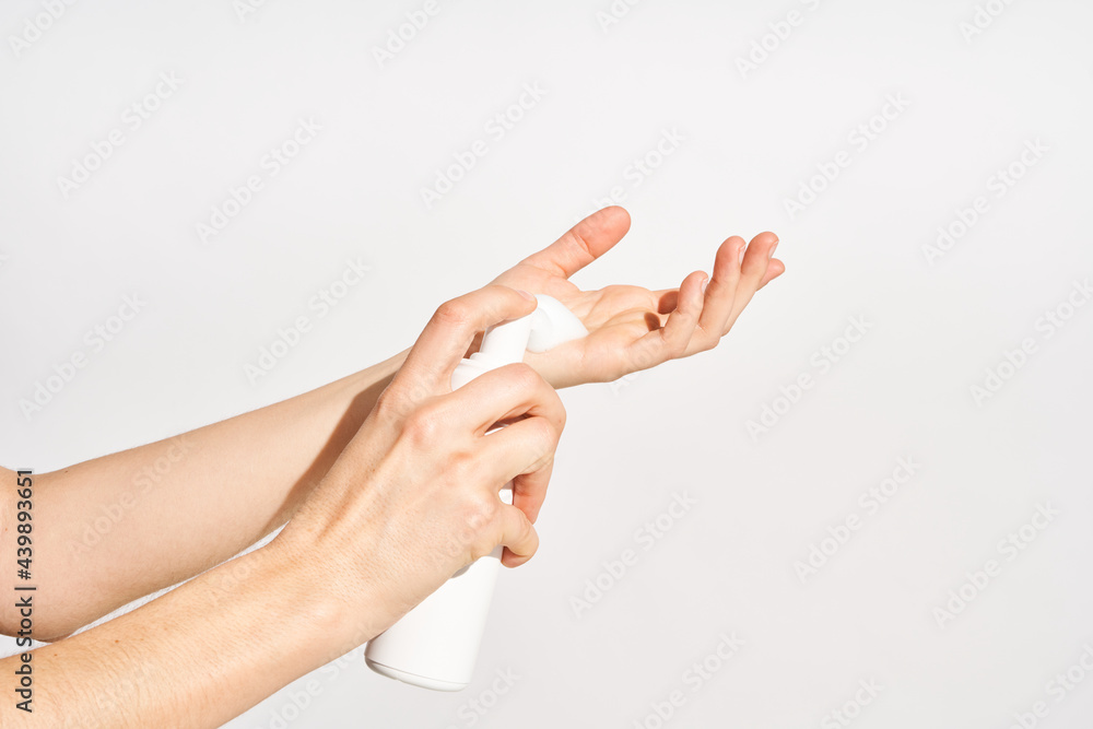 Woman applying mousse beauty product Woman applying mousse beauty product
