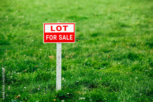 Wallpaper Mural lot for sale plate sign, green grass background Torontodigital.ca