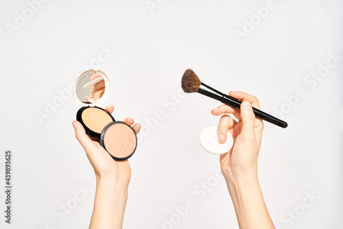 Woman with makeup powder and accessories photo