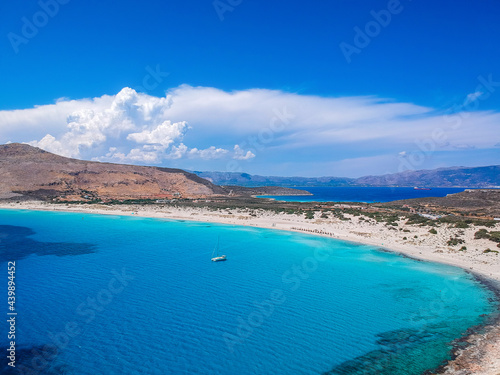Aerial view of Simos beach in Elafonisos island in Greece. Elafonisos is a small Greek island the Peloponnese with idyllic exotic beaches and crystal clear waters. Laconia, Greece, Europe © panosk18