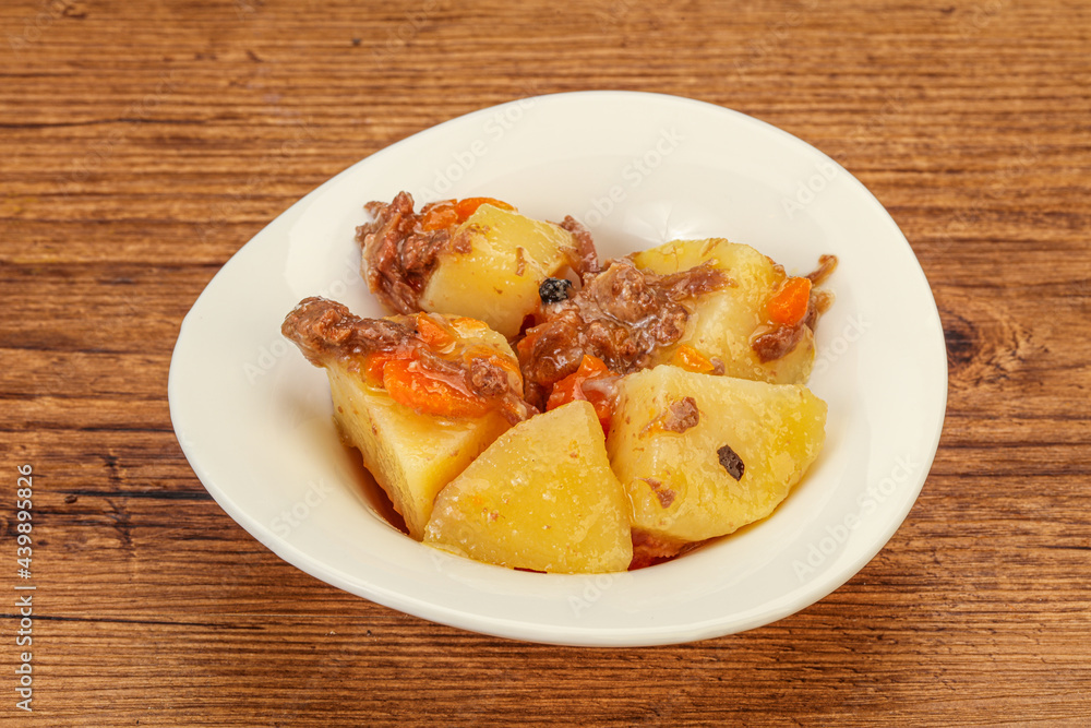 Roasted potato and beef with sauce Roasted potato and beef with sauce