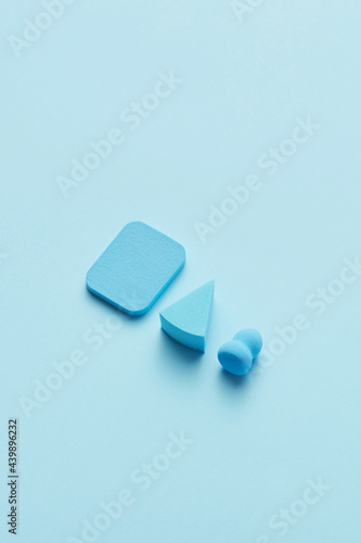 Three blue makeup sponges photo