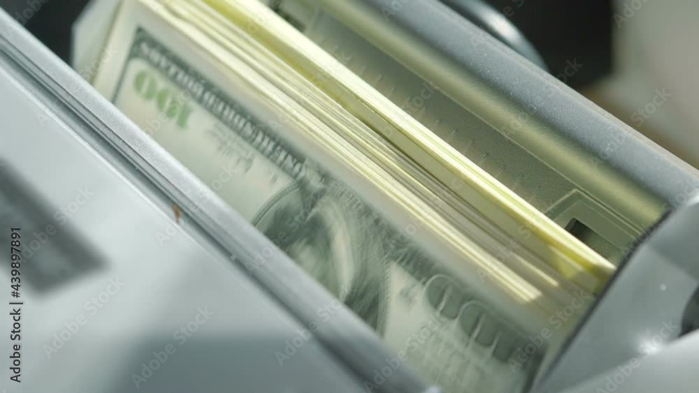 Machine counter automatic calculates a large amount of Dollar banknotes in Slow motion 180fps Machine counter automatic calculates a large amount of Dollar banknotes in Slow motion 180fps