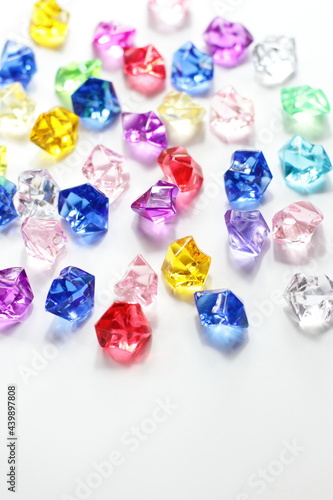 Colorful gems background, blue red green yellow white crystals 
