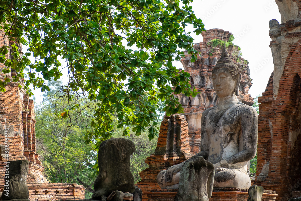 Ancient pagoda and Buddha statue in Wat Mahathat , Ayutthaya