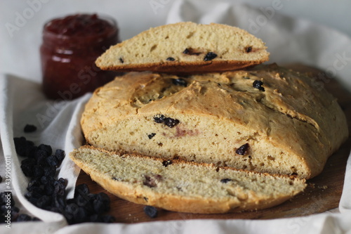 Slices of home baked Irish soda bread with raisins. A quick bread to make at home with out yeast. Served with fig jam.