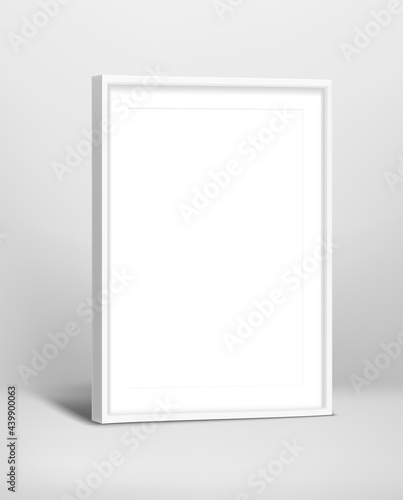 White modern photo frame neer the wall