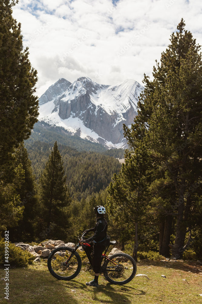 Mountain biker into the high mountains Mountain biker into the high mountains
