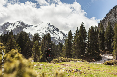 Mountain biker crossing the mountains photo