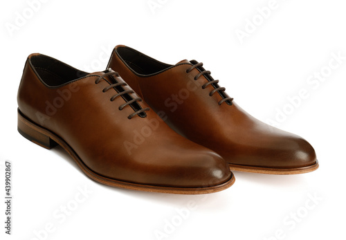 Men's brown oxford fashion shoes isolated on a white background.