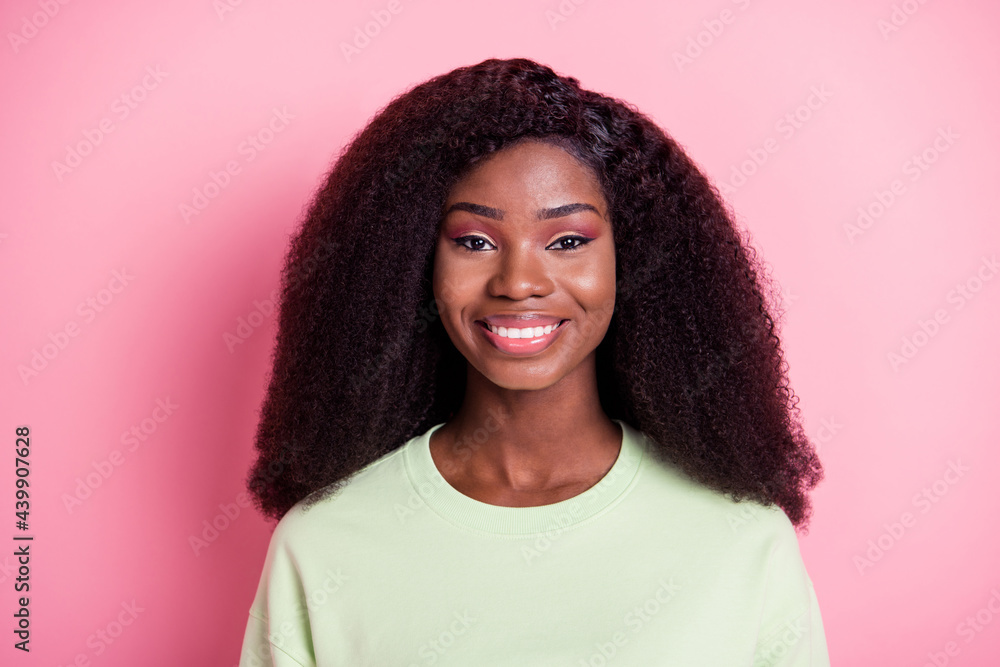 Photo of young beautiful charming positive good mood afro girl smiling wear sweater isolated on pink color background Photo of young beautiful charming positive good mood afro girl smiling wear sweater isolated on pink color background