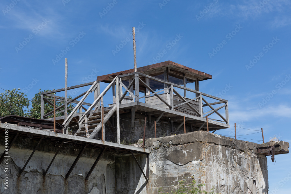 Wooden watchtower on the stony wall of the fort in Kronshtadt, Russia. Wooden watchtower on the stony wall of the fort in Kronshtadt, Russia.