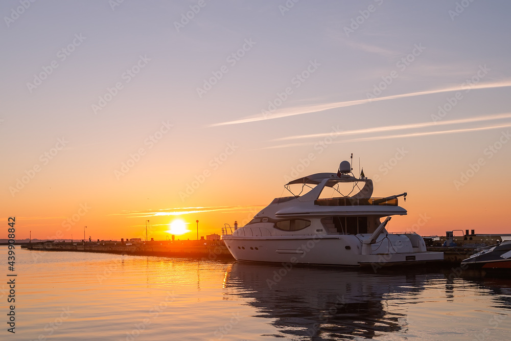 Harbor Elegance: Yacht Club Sunrise with Power Boat