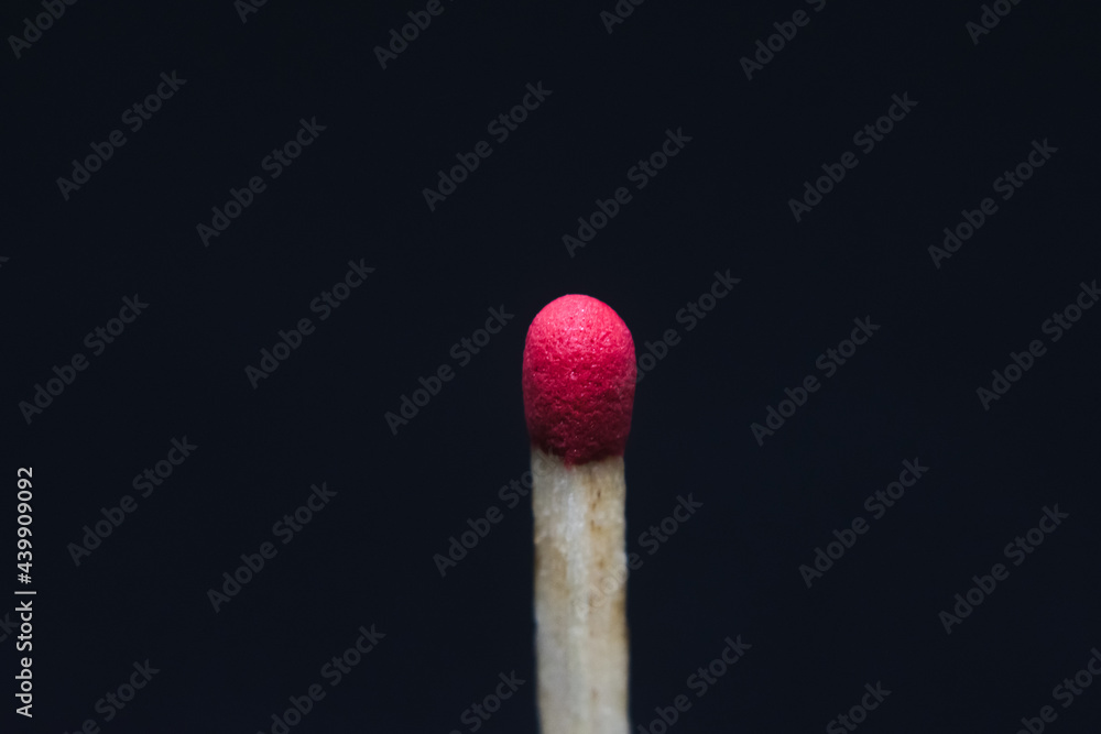 Red tipped match, macro photography, black infinite background Red tipped match, macro photography, black infinite background