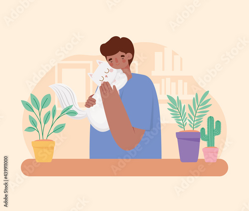 man hugging cat