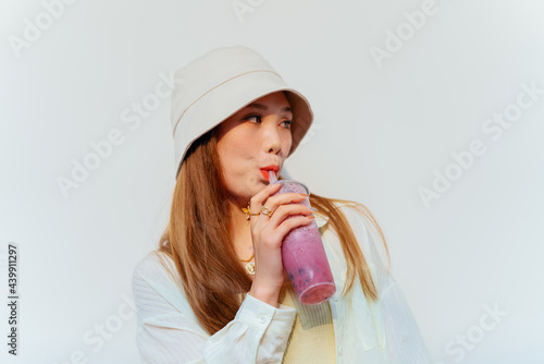 fashion Asian woman drinking juice