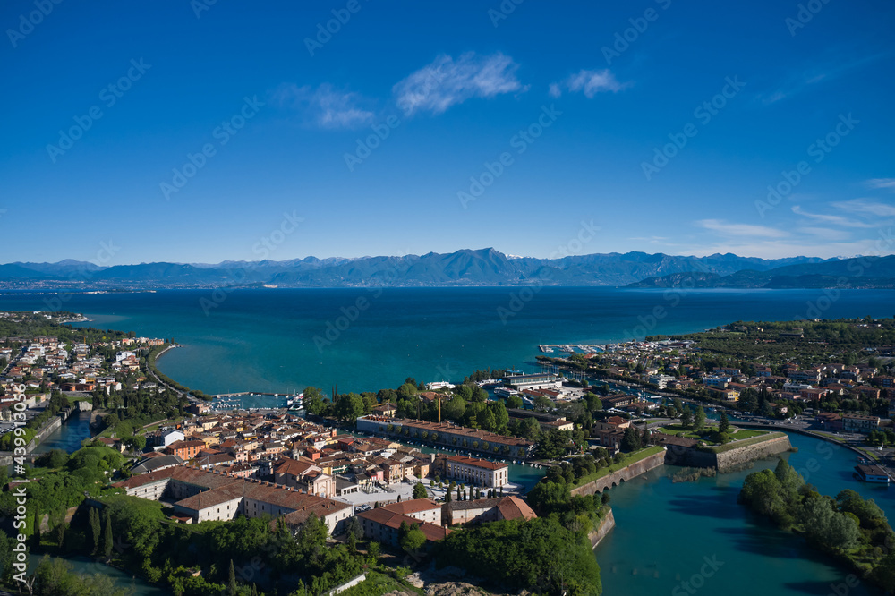 Italian city on the water. Peschiera del Garda, aerial view of Lake Garda, Italy. Water channels in the historic town of Peschiera del Garda.