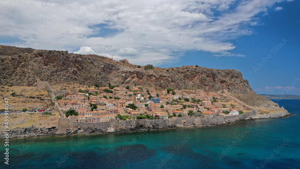 Fototapeta premium Aerial drone photo of new city of Monemvasia in the heart of Lakonia with beautiful clouds and deep blue sky, Peloponnese, Greece