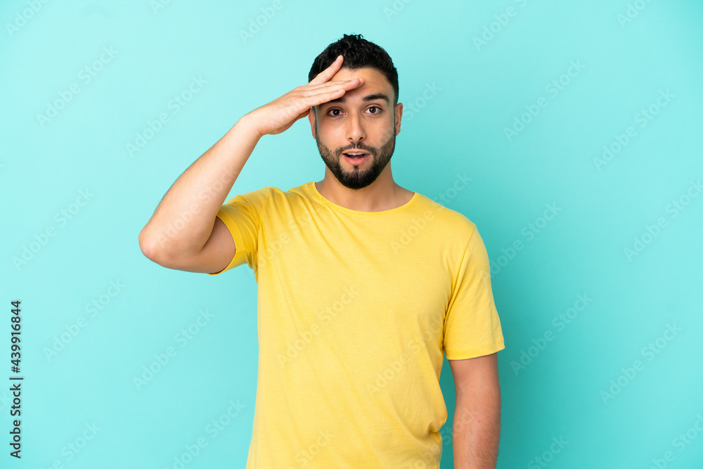 Young arab man isolated on blue background has realized something and intending the solution Young arab man isolated on blue background has realized something and intending the solution