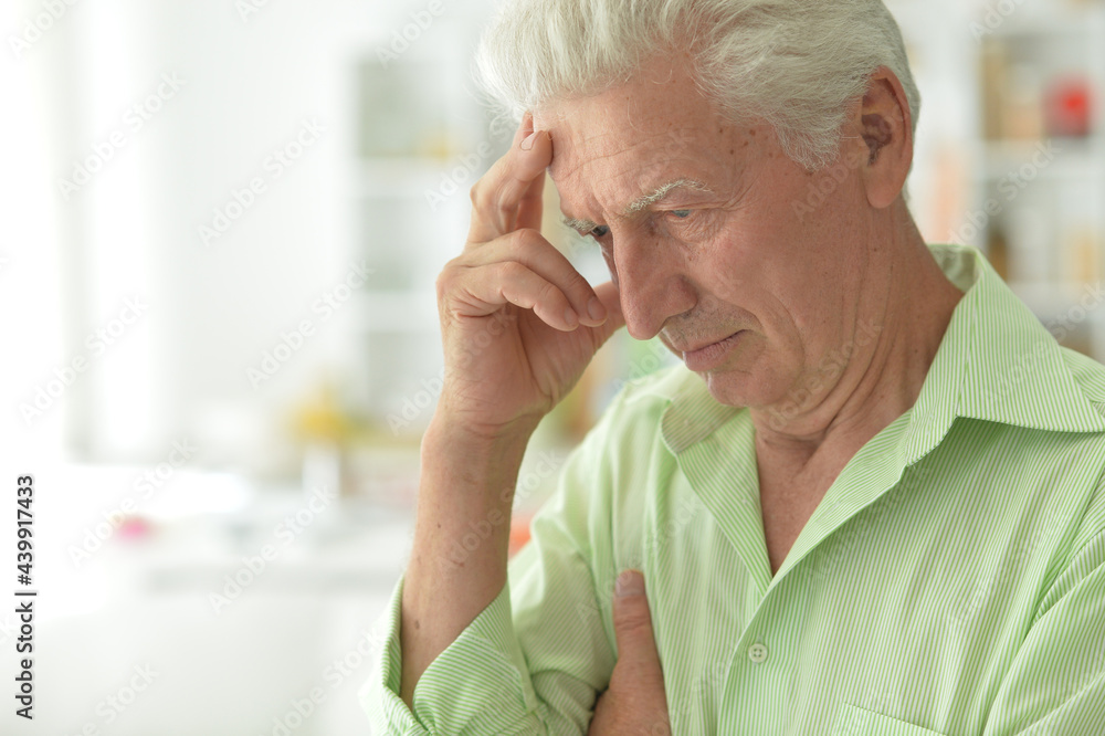 Close up portrait of thoughtful senior man at home Close up portrait of thoughtful senior man at home