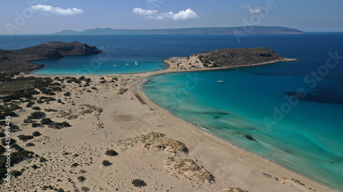 Aerial photo taken by drone of Caribbean tropical exotic island bay with turquoise clear sea sandy beaches resembling a blue lagoon visited by sail boats