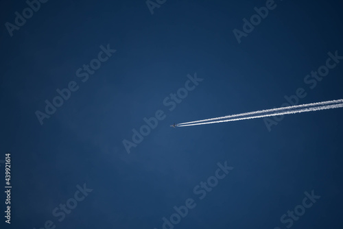 Photo of plane flying in blue sky,transportation