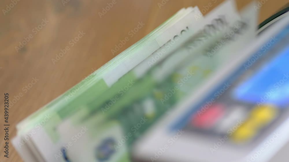 Machine counter automatic calculates a large amount of Euro banknotes in 4K Slow motion 60fps Machine counter automatic calculates a large amount of Euro banknotes in 4K Slow motion 60fps