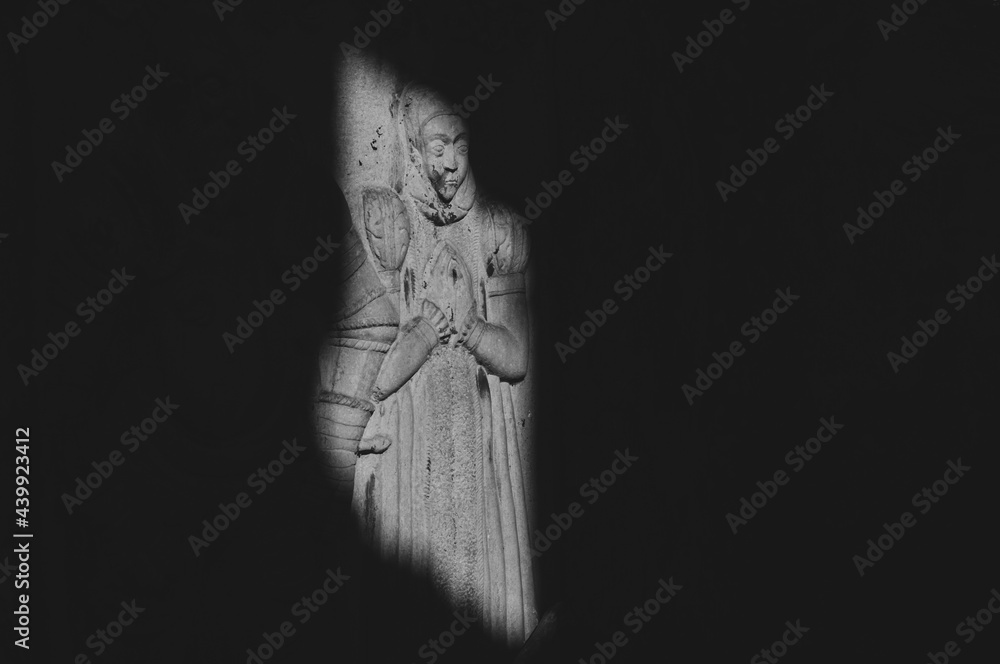 Bas-relief in the ruins of an old church from the 15th century - obrazy, fototapety, plakaty 