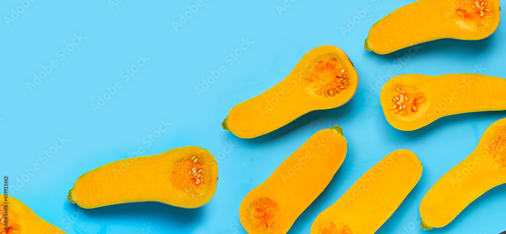 Cut butternut squash on blue background. Cut butternut squash on blue background.