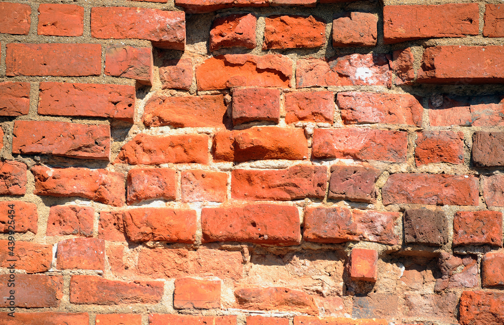 Obraz premium Old brick wall in old part of town in Warsaw.