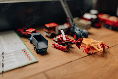 Canvas Print Selective focus shot of different toys on a wooden surface with blurred backgrou