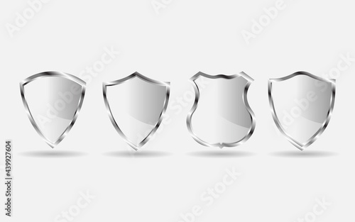 Set of metal shield. Silver shield badge isolated on white background.