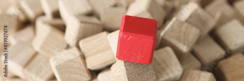 Konstfotografi Wooden cubes of beige color in middle there is red cube
