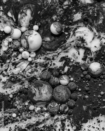 Black and white abstract background from acrylic paints and oil mix, Macro bubble photography for wall art. Acrylic paint and oil mix forming Bubble in black and white..