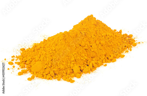 Turmeric powder pile isolated on a white background. Yellow curcuma powder. Indian spice.